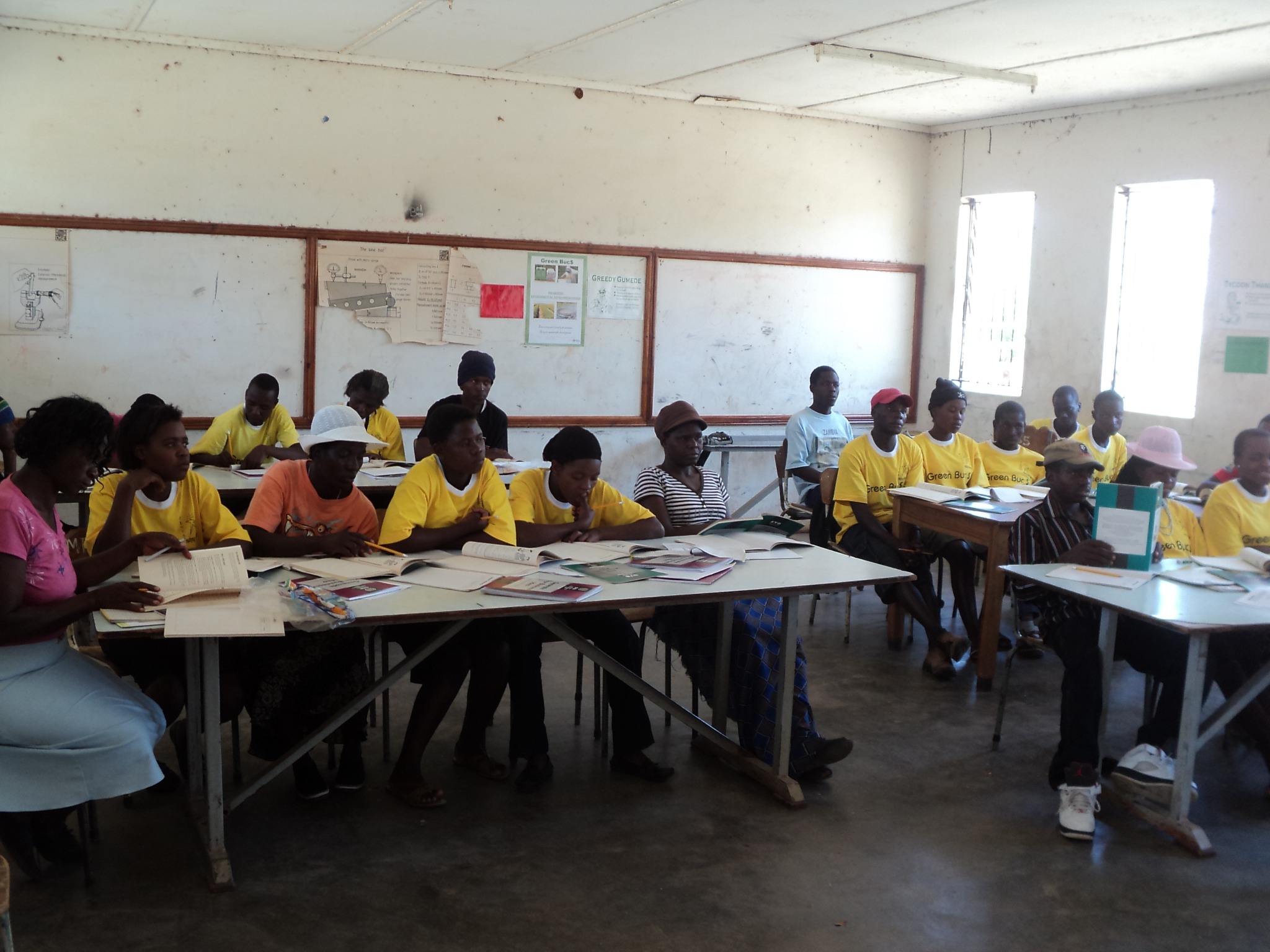 Adults sharing a classroom learning session